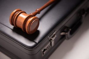 FBAR Penalties Lawyer Connecticut- wooden gave on briefcase